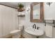 This modern bathroom has a vanity sink, a wooden framed mirror, decor shelves, and a shower at 8260 Overview Ct, Roswell, GA 30076