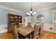 Dining room with hardwood floors, chandelier, and wooden furniture at 8260 Overview Ct, Roswell, GA 30076