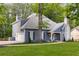 Beautiful exterior of a home with blue siding, an attached garage, and a stone chimney at 8260 Overview Ct, Roswell, GA 30076