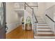 Inviting foyer with hardwood floors, staircase, and natural light at 8260 Overview Ct, Roswell, GA 30076