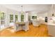 Gourmet kitchen with stainless steel appliances, island, and adjacent dining area at 8260 Overview Ct, Roswell, GA 30076