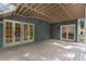 Lower level walkout basement featuring a covered deck with access to the backyard at 8260 Overview Ct, Roswell, GA 30076