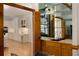 Oak wet bar with sink and mirrors, seen from the living room at 8260 Overview Ct, Roswell, GA 30076