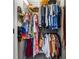 Walk-in closet featuring shelving, closet rods, and an array of colorful clothing and accessories at 120 Biscayne Nw Dr # C13, Atlanta, GA 30309