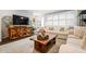 Inviting living room with large windows, neutral walls, stylish furniture and light-colored sofa, creating a cozy atmosphere at 120 Biscayne Nw Dr # C13, Atlanta, GA 30309