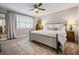 Spacious main bedroom featuring a neutral color palette and large area rug with lots of natural light at 120 Biscayne Nw Dr # C13, Atlanta, GA 30309