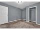 Carpeted bedroom with closet and neutral paint at 1911 Rosewood Rd, Decatur, GA 30032