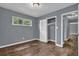 Bedroom with hardwood floors, closet, and natural light at 1911 Rosewood Rd, Decatur, GA 30032