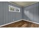 Bedroom with hardwood flooring, paneled walls, a window providing natural light at 1911 Rosewood Rd, Decatur, GA 30032