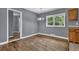 Dining area boasts hardwood floors, a modern light fixture, and natural light at 1911 Rosewood Rd, Decatur, GA 30032