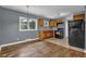 Kitchen with wood cabinets, black appliances and a tile floor at 1911 Rosewood Rd, Decatur, GA 30032