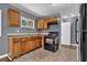 Functional kitchen with wood cabinets and modern appliances at 1911 Rosewood Rd, Decatur, GA 30032