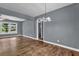 Charming living room boasts hardwood floors and a vintage chandelier at 1911 Rosewood Rd, Decatur, GA 30032