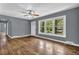 Living room with hardwood floors, neutral paint and a window overlooking a yard at 1911 Rosewood Rd, Decatur, GA 30032