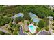 Aerial shot of community featuring tennis courts, swimming pool, and lush green trees at 765 Vinings Estates Se Dr, Mableton, GA 30126