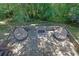 Elevated brick patio featuring two round seating areas and a fire pit at 765 Vinings Estates Se Dr, Mableton, GA 30126