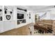 Basement living room boasts built-in shelving and cabinet space for storage at 765 Vinings Estates Se Dr, Mableton, GA 30126