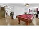The basement hosts a lovely billiard room with a beautiful pool table at 765 Vinings Estates Se Dr, Mableton, GA 30126