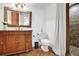 This cozy bathroom offers a single vanity, toilet, and tiled walk-in shower at 765 Vinings Estates Se Dr, Mableton, GA 30126