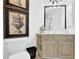 A half bathroom with decorative accents including framed art and an ornate mirror at 765 Vinings Estates Se Dr, Mableton, GA 30126