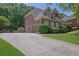 Lovely home featuring a three-car garage and a long driveway at 765 Vinings Estates Se Dr, Mableton, GA 30126