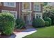 Inviting front entrance featuring a brick walkway and manicured landscaping at 765 Vinings Estates Se Dr, Mableton, GA 30126