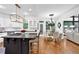 A view of the kitchen, dining area, and living room shows the open floor plan and abundance of natural light at 765 Vinings Estates Se Dr, Mableton, GA 30126