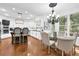 Stylish eat-in kitchen with modern appliances, a large island and wood flooring at 765 Vinings Estates Se Dr, Mableton, GA 30126