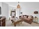Cozy living room featuring a comfortable sofa, decorative mirror, and soft lighting at 765 Vinings Estates Se Dr, Mableton, GA 30126