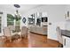 Open-concept living space boasts hardwood floors, a cozy seating area, and large windows for lots of natural light at 765 Vinings Estates Se Dr, Mableton, GA 30126