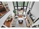 Grand living room with soaring ceilings and an oversized window with lots of natural light at 765 Vinings Estates Se Dr, Mableton, GA 30126