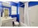 Clean bathroom features a vanity, toilet, shower and white tile surround at 1050 Hampton Hill Ct, Lawrenceville, GA 30044