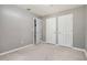 Neutral bedroom with three doors and carpet flooring at 1050 Hampton Hill Ct, Lawrenceville, GA 30044