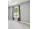 Bright bedroom with carpet, neutral walls, and large window at 1050 Hampton Hill Ct, Lawrenceville, GA 30044