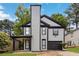 Charming two-story home featuring light gray siding, a tall chimney, and a single-car garage at 1050 Hampton Hill Ct, Lawrenceville, GA 30044