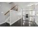 Bright foyer with stairs and view into the living room that has a fireplace at 1050 Hampton Hill Ct, Lawrenceville, GA 30044