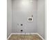 Empty laundry room with hookups and neutral walls and tile flooring at 1050 Hampton Hill Ct, Lawrenceville, GA 30044