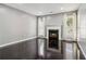 Bright living room featuring a fireplace, large windows and shiny, dark flooring at 1050 Hampton Hill Ct, Lawrenceville, GA 30044