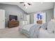 Serene main bedroom with vaulted ceiling, dresser, television, and ensuite bathroom access at 1050 Hampton Hill Ct, Lawrenceville, GA 30044