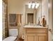 Neutral bathroom with a granite vanity and a framed mirror at 1942 N Akin Ne Dr, Atlanta, GA 30345