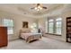 Bright bedroom features a bed, window seat, and built-in bookshelf, perfect for relaxation and reading at 1942 N Akin Ne Dr, Atlanta, GA 30345