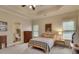 Bright bedroom with a tray ceiling, neutral paint, and carpeted flooring for a comfortable and inviting space at 1942 N Akin Ne Dr, Atlanta, GA 30345