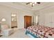 Bedroom with a trey ceiling, adjacent bathroom, and a cozy armchair, perfect for relaxation and convenience at 1942 N Akin Ne Dr, Atlanta, GA 30345