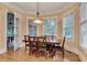 Inviting dining room filled with natural light, a wooden table, and access to a porch at 1942 N Akin Ne Dr, Atlanta, GA 30345