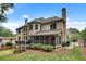 Stunning brick home showcasing a screened porch, deck, a basketball court, and well-maintained landscaping at 1942 N Akin Ne Dr, Atlanta, GA 30345