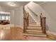 Foyer with hardwood floors, wooden staircase, and an open view into the living area for a welcoming entrance at 1942 N Akin Ne Dr, Atlanta, GA 30345