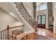 Foyer with hardwood floors, staircase, and ornate banister at 1942 N Akin Ne Dr, Atlanta, GA 30345