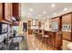 Spacious kitchen featuring an island with seating, stainless steel appliances, and granite countertops at 1942 N Akin Ne Dr, Atlanta, GA 30345