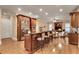Open concept kitchen with stainless steel appliances, an island with seating, and a view of the living area at 1942 N Akin Ne Dr, Atlanta, GA 30345