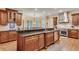 Eat-in kitchen boasting a large island, stainless steel appliances, custom cabinets, and a view of the backyard at 1942 N Akin Ne Dr, Atlanta, GA 30345